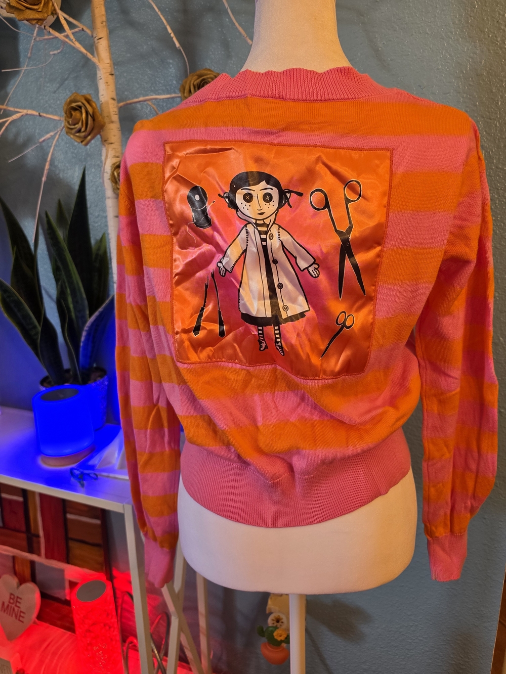 Spirit Pink and Orange Striped Women's Sweater Featuring Coraline Back Patch